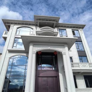 天水白麻别墅外墙干挂石材效果示例